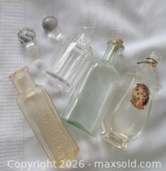 MaxSold Auction: Antique Four (4)Glass Bottle Collection: Clear + light Green Bottles Lot - Ottawa (Ontario, Canada) SELLER MANAGED Downsizing Online Auction -  Woodpark Way