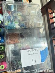 MaxSold Auction: Multicolor Sewing Thread, Beads, Plastic Organizer & Wooden Rack - Los Angeles (California, USA) PARTNER MANAGED Downsizing Online Auction - Sapphire Drive