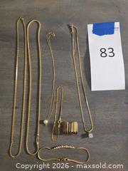 MaxSold Auction: 14K Yellow Gold Jewelry Lot: Necklace, Bracelet, Pendant - Los Angeles (California, USA) PARTNER MANAGED Moving Online Auction - W 36th Street (CONDO)