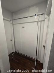 MaxSold Auction: Chrome Steel Adjustable Garment Rack with Casters, 60 in wide - Los Angeles (California, USA) PARTNER MANAGED Moving Online Auction - W 36th Street (CONDO)
