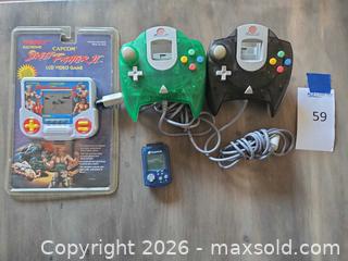 MaxSold Auction: Dream Cast Controllers, Device and Street Fighter II LCD Video Game Capcom  - Los Angeles (California, USA) PARTNER MANAGED Moving Online Auction - W 36th Street (CONDO)
