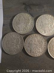 MaxSold Auction: Lot of 7 Morgan Silver Dollars 90% Silver - Los Angeles (California, USA) PARTNER MANAGED Moving Online Auction - W 36th Street (CONDO)