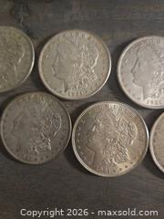 MaxSold Auction: Lot of 7 Morgan Silver Dollars 90% Silver - Los Angeles (California, USA) PARTNER MANAGED Moving Online Auction - W 36th Street (CONDO)