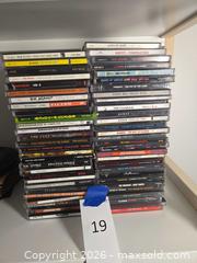 MaxSold Auction: Rock CDs Lot  - Los Angeles (California, USA) PARTNER MANAGED Moving Online Auction - W 36th Street (CONDO)