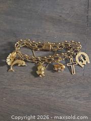 MaxSold Auction: Yellow Gold 14KT Charm Bracelet with Charms - Los Angeles (California, USA) PARTNER MANAGED Moving Online Auction - W 36th Street (CONDO)