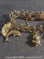 MaxSold Auction: Yellow Gold 14KT Charm Bracelet with Charms - Los Angeles (California, USA) PARTNER MANAGED Moving Online Auction - W 36th Street (CONDO)