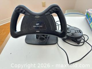 MaxSold Auction: Sega Saturn Steering Wheel and Controller with Base & Cables - Mississauga (Ontario, Canada) SELLER MANAGED Estate Sale Online Auction - Robinwood Court