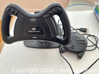 MaxSold Auction: Sega Saturn Steering Wheel and Controller with Base & Cables - Mississauga (Ontario, Canada) SELLER MANAGED Estate Sale Online Auction - Robinwood Court