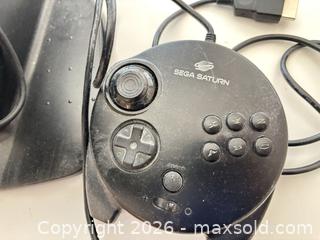 MaxSold Auction: Sega Saturn Steering Wheel and Controller with Base & Cables - Mississauga (Ontario, Canada) SELLER MANAGED Estate Sale Online Auction - Robinwood Court