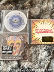 MaxSold Auction: Lot of 3 Rock CDs: Aerosmith & Scorpions Never opened - Toronto (Ontario, Canada) SELLER MANAGED Downsizing Online Auction - Davenport Road (CONDO)