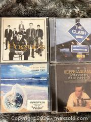 MaxSold Auction: Lot of 4 Sealed CDs: Pogues, The Clash, Moody Blues, Robbie Williams - Toronto (Ontario, Canada) SELLER MANAGED Downsizing Online Auction - Davenport Road (CONDO)