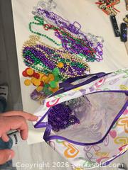 MaxSold Auction: Mardi Gras Beads & Plastic Coins Assortment with Storage Bag - Hamilton (Ontario, Canada) SELLER MANAGED Downsizing Online Auction - Bobalink Road.