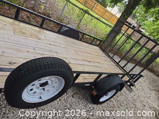 MaxSold Auction: 12 ft x 6'8" Single-Axle Utility Trailer, Black Frame - Lakeland (Florida, USA) PARTNER MANAGED Downsizing Online Auction - Shore Acres Drive