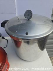 MaxSold Auction: Cookware lot: enamel canners, Lodge Dutch oven, Presto popper, pressure canner - Lakeland (Florida, USA) PARTNER MANAGED Downsizing Online Auction - Shore Acres Drive