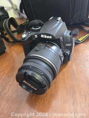 MaxSold Auction: Nikon D7000 & D5000 DSLR Bodies with Multiple Lenses & Accessories - Lakeland (Florida, USA) PARTNER MANAGED Downsizing Online Auction - Shore Acres Drive