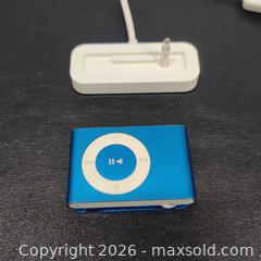 MaxSold Auction: 4th gen Blue Apple iPod Shuffle with Charging Base - Toronto (Ontario, Canada) SELLER MANAGED Downsizing Online Auction - Metropolitan Road (STORAGE)