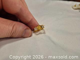 MaxSold Auction: Gold colored Ring with one yellow middle stone and two clear stones on each side. - Ottawa (Ontario, Canada) SELLER MANAGED Downsizing Online Auction - St.-Denis Street