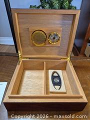 MaxSold Auction: Humidor with Hygrometer, Cutter, Divider and instructions to maintain perfect humidity - Ottawa (Ontario, Canada) SELLER MANAGED Downsizing Online Auction - St.-Denis Street