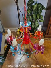 MaxSold Auction: Multicolor Five-Arm Chandelier and IKEA Blue Star Night Light - Ottawa (Ontario, Canada) SELLER MANAGED Downsizing Online Auction - St.-Denis Street