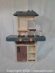 MaxSold Auction: Plastic Play Kitchen with Electronic Burners and Faucet - Brantford (Ontario, Canada) SELLER MANAGED Downsizing Online Auction - Kitchener Avenue