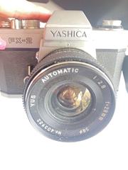 MaxSold Auction: Yashica FX-2 35mm SLR with YUS 28mm Lens & Panasonic Camcorder - Rochester (New York, USA) SELLER MANAGED Reseller Online Auction - Mendota Drive 