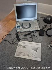 MaxSold Auction: Mixed Electronics Lot: Portable DVD, Speakers, Cameras, Alarm - Ottawa (Ontario, Canada) SELLER MANAGED Downsizing Online Auction - Westhaven Crescent