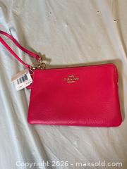 MaxSold Auction: Coach New York Corner Zip Wristlet – Pink Ruby Pebbled Leather, Gold Hardware, NWT - Toronto (Ontario, Canada) SELLER MANAGED Moving Online Auction - Howard Park Avenue