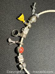 MaxSold Auction: Pandora Leather necklaces Lot – 2 necklaces with Charms | White & Pink Braided Leather, S92 - Toronto (Ontario, Canada) SELLER MANAGED Moving Online Auction - Howard Park Avenue