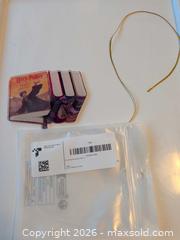 MaxSold Auction: Harry Potter Stack of Books Acrylic Ornament, Multicolor & Gold - Vancouver (British Columbia, Canada) SELLER MANAGED Downsizing Online Auction - Shaughnessy Street