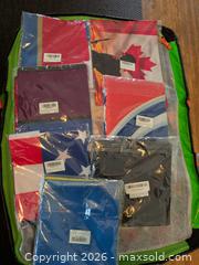 MaxSold Auction: HUGE BULK ASSORTED BANNER FLAGS approx 500 units new sealed  - Vancouver (British Columbia, Canada) SELLER MANAGED Downsizing Online Auction - Shaughnessy Street