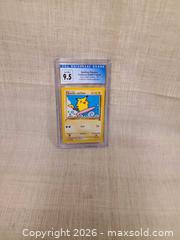 MaxSold Auction: Pikachu Black Star Promo (Surfing Pikachu) French Trading Card - Toronto (Ontario, Canada) SELLER MANAGED Downsizing Online Auction - Rutland Street