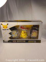 MaxSold Auction: Pokemon Celebrations Pikachu VMAX Figure & Trading Cards - Toronto (Ontario, Canada) SELLER MANAGED Downsizing Online Auction - Rutland Street