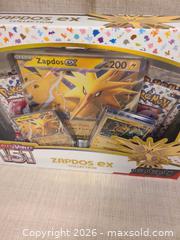 MaxSold Auction: Pokémon Scarlet & Violet 151 Zapdos TCG Box/Collection - Toronto (Ontario, Canada) SELLER MANAGED Downsizing Online Auction - Rutland Street