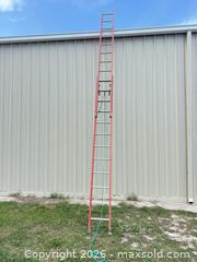 MaxSold Auction: Red Fiberglass Extension Ladder, 20–30 ft, 12–20 Rungs - Polk City (Florida, USA) SELLER MANAGED Downsizing Online Auction - Conley Drive