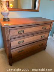 MaxSold Auction: Wooden Four-Drawer Dresser with Brass Handles - Kingston (Ontario, Canada) PARTNER MANAGED Downsizing Online Auction - Sunnyside Road