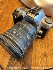 MaxSold Auction: Canon AE-1 Program & Minolta Maxxum XTsi PLUS Film SLR Kit - Hamilton (Ontario, Canada) SELLER MANAGED Estate Sale Online Auction -  John Street North