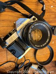 MaxSold Auction: Canon AE-1 Program & Minolta Maxxum XTsi PLUS Film SLR Kit - Hamilton (Ontario, Canada) SELLER MANAGED Estate Sale Online Auction -  John Street North