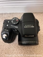 MaxSold Auction: Fujifilm FinePix S2000HD Bridge Camera 10MP 15x Zoom Black with case - Burlington (Ontario, Canada) SELLER MANAGED Downsizing Online Auction -  Taylor Crescent