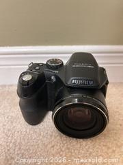 MaxSold Auction: Fujifilm FinePix S2000HD Bridge Camera 10MP 15x Zoom Black with case - Burlington (Ontario, Canada) SELLER MANAGED Downsizing Online Auction -  Taylor Crescent
