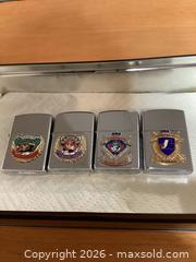 MaxSold Auction: (4) CANADIAN TEAMS CIGARETTE LIGHTERS  - St. Thomas (Ontario, Canada) SELLER MANAGED Downsizing Online Auction - Coleman Court