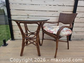 MaxSold Auction: 2-Piece Vintage Multi Brown Rattan and Bamboo Bistro/Patio Set with Glass Top & Cushions - Table - 29.5"W x 30"H      Chair - 23.75"W x 33.75"H - Kingston (Ontario, Canada) SELLER MANAGED Downsizing Online Auction - Abdo Road