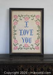 MaxSold Auction: Dated 1979 "I Love You" cross-stitch on vintage linen with pink flowers in a solid wood vintage frame - 15.25"L x 11.25"W  - Kingston (Ontario, Canada) SELLER MANAGED Downsizing Online Auction - Abdo Road