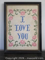 MaxSold Auction: Dated 1979 "I Love You" cross-stitch on vintage linen with pink flowers in a solid wood vintage frame - 15.25"L x 11.25"W  - Kingston (Ontario, Canada) SELLER MANAGED Downsizing Online Auction - Abdo Road