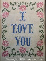 MaxSold Auction: Dated 1979 "I Love You" cross-stitch on vintage linen with pink flowers in a solid wood vintage frame - 15.25"L x 11.25"W  - Kingston (Ontario, Canada) SELLER MANAGED Downsizing Online Auction - Abdo Road