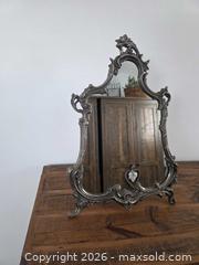 MaxSold Auction: Vintage 1940s - 1950s  Baroque Silver-tone Table Mirror - Elegant Detailing - 18.5"H x 13"W - Kingston (Ontario, Canada) SELLER MANAGED Downsizing Online Auction - Abdo Road