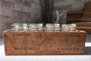 MaxSold Auction: Vintage Maple Leaf Glass Jars with Wooden Crate - Size: 12"L x 4" W x 3.75"H - Kingston (Ontario, Canada) SELLER MANAGED Downsizing Online Auction - Abdo Road