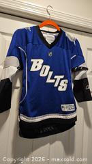 MaxSold Auction: Lightning Bolts Lecavalier Youth Jersey - Riverview (Florida, USA) SELLER MANAGED Downsizing Online Auction - Holly Heath Drive