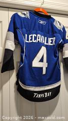 MaxSold Auction: Lightning Bolts Lecavalier Youth Jersey - Riverview (Florida, USA) SELLER MANAGED Downsizing Online Auction - Holly Heath Drive