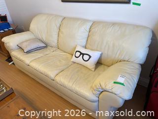 MaxSold Auction: Off-White Leather Three-Seat Sofa with Decorative Throw Pillows - Leeds And The Thousand Islands (Ontario, Canada) PARTNER MANAGED Downsizing Online Auction - Main Street