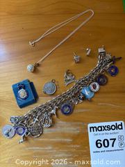 MaxSold Auction: Sterling Silver Charm Bracelet, Necklace, and Earrings Set - Leeds And The Thousand Islands (Ontario, Canada) PARTNER MANAGED Downsizing Online Auction - Main Street